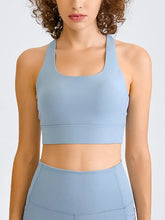Millennia light blue racerback sports bra with high neckline for bust support