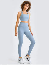 Blue ribbed leggings with white sneakers and cropped tank for bust length