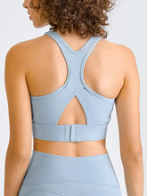 Light blue Millennia Double Take racerback sports bra with adjustable bust straps