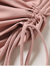 Pink Millennia Drawstring Round macrame bag on active T-shirt