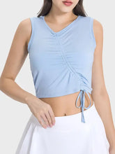 Light blue Millennia active tank with ruched front, drawstring, machine wash cold