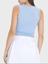 Light blue sleeveless Millennia active tank with ruched high neckline