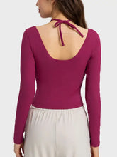 Millennia Halter long sleeve sporty top in magenta with tie-back detail