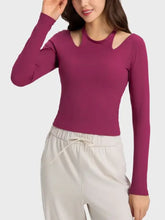 Millennia halter neck long sleeve sporty top with purple fabric, cut-out shoulders, and ribbed cuffs