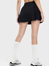 Black Millennia pleated active skirt with mid-rise waist, white socks, sneakers