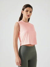 Millennia Round Neck pink cropped active tank with green leggings
