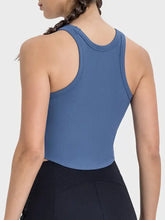 Millennia Round Neck Racerback Active Tank in blue ribbed fabric with black leggings