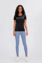 Millennia round neck short sleeve active t-shirt with white sneakers and light blue leggings