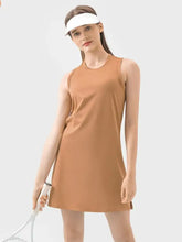Brown round neck sleeveless tennis dress with white visor and racket