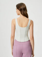 Millennia round neck active tank in lavender leggings and light blue open-back top with detachable chest pads