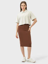 Millennia Slit Wrap Active Skirt in brown with white sneakers and cream blouse