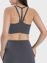 Charcoal gray square neck sports bra with crisscross back, padded cups