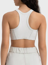 White ribbed Millennia Wide Strap Cropped Sport Tank with racerback, elastic waistband, medium bust length