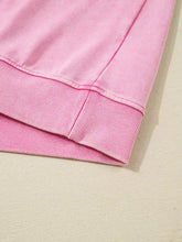 Pink ribbed knit hem of mineral wash cross crew neck drop shoulder loose sweatshirt with machine wash care instructions