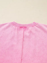 Soft pink mineral wash cotton crew neck sweatshirt with ribbed neckline and central seam on the back, machine wash care instructions