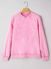 Pink oversized mineral wash crew neck sweatshirt with soft faded fabric and ribbed cuffs machine wash care instructions