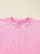 Pink mineral wash cotton crewneck sweatshirt with ribbed collar suitable for machine wash care instructions