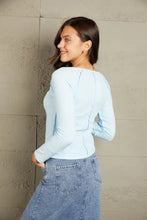 Light blue mineral wash exposed seam long sleeve top with scoop neck