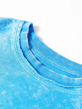 A vibrant blue tie-dye cotton mineral wash t-shirt with ribbed crew neck and machine wash care instructions
