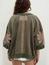 Olive green mineral wash oversized sweatshirt with beige floral patches on sleeves and vertical seam on back side