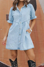 Light blue mineral wash denim dress with short puffed ruffle sleeves and button front detail
