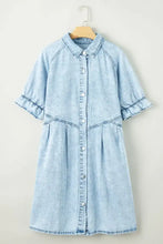Light blue mineral wash denim dress with short sleeves and button-front design featuring ruffle details