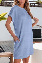 Mint green textured short-sleeve mini dress with pockets