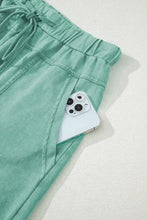 Mint green cotton drawstring shorts with pocket and phone holder