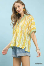 Yellow floral print boho blouse with green striped contrast trim and short sleeves in mix print boho style