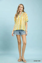 Yellow and green patterned mix print boho blouse with contrast trim and v-neckline in lightweight fabric