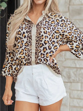 Women’s mixed leopard patchwork button-up blouse with cream collar and cuffs and three-quarter length sleeves