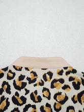 A mixed leopard patchwork 3/4 sleeve loose shirt featuring a beige collar and leopard print blouse design