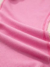 Soft pink slightly stretchy waffle-knit fabric with textured grid pattern in mixed texture waffle floral patchwork pullover