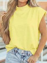 Bright yellow sleeveless mock neck cap sleeve blouse with relaxed fit and high neckline for casual wear