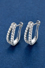 Pair of sterling silver earrings with pavé-set round diamonds