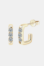 Pair of sterling silver geometrical huggie earrings with gold-toned square hoops and three round-cut diamonds each