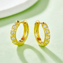 Gold hoop huggie earrings in 925 sterling silver with clear cubic zirconia stones