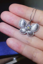 Moissanite butterfly pendant necklace with green gemstone center