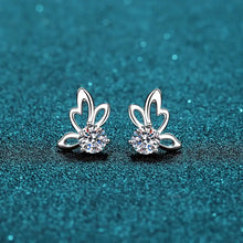 Silver moissanite butterfly shape stud earrings with round-cut gemstones