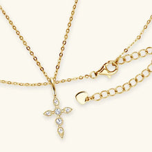Elegant moissanite cross pendant necklace with gold chain and diamond accents