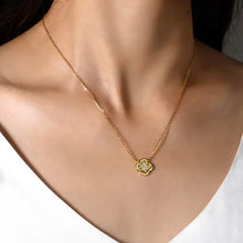 Delicate gold moissanite leaf clover necklace with sparkling diamond accents