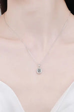 Silver moissanite pendant necklace with light green gem and diamond accents