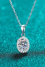 Elegant moissanite pendant necklace with silver chain and oval diamond accents