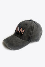 Washed black mom baseball cap with peach M and football graphic