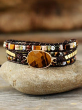 Multi-strand leather bracelet with tiger’s eye gemstone and beaded accents