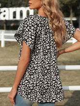 Black and white floral print short sleeve top with flutter sleeves styled with multicolor v neck short sleeve leopard blouse