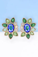 Gold and green glass stone dangle earrings with floral and geometrical shapes