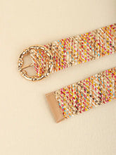Multicolored wide belt with gold bamboo-style buckle on beige background