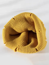 Mustard yellow distressed cuffed knit hat with ribbed details