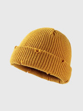 Mustard yellow distressed cuffed knit hat with ribbed texture